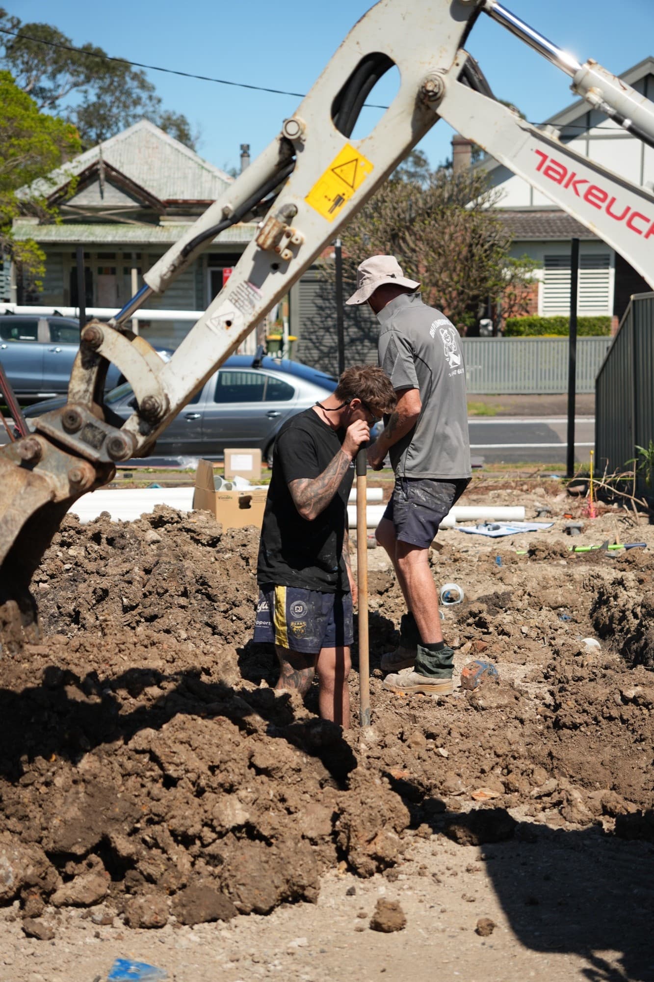 Zimco crew digging out drainage under the excavator arm