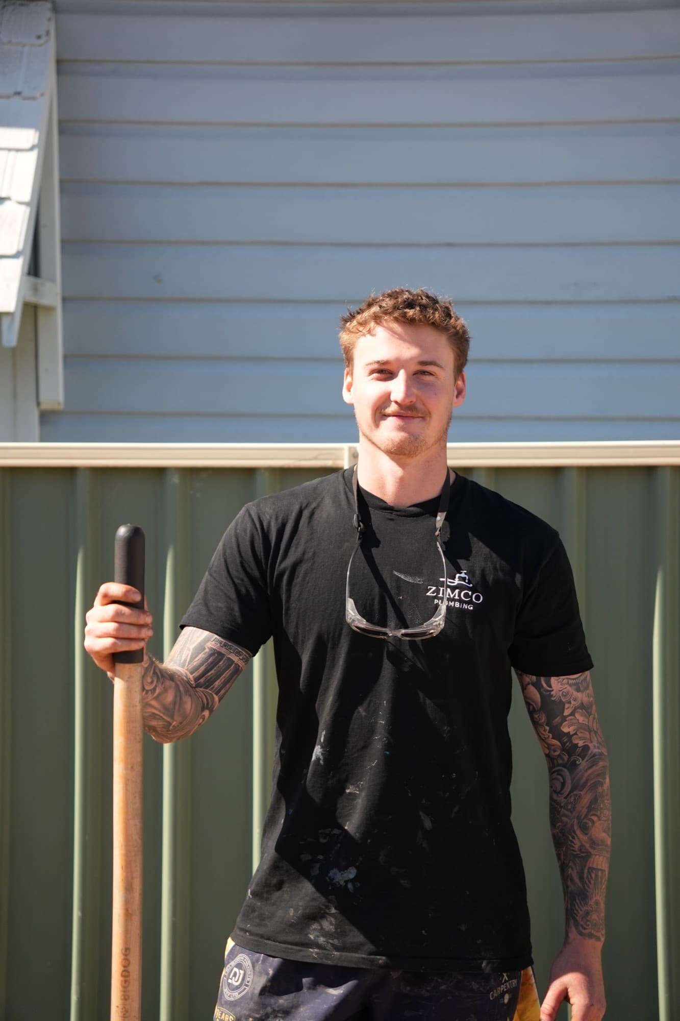 Zimco plumber Riley Toth on site with a shovel